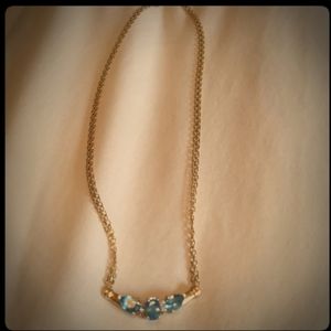 Aquamarine with 14K gold setting.